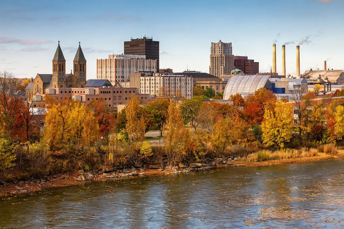 Downtown Akron skyline with the Cuyahoga River in the foreground on an autumn afternoon
