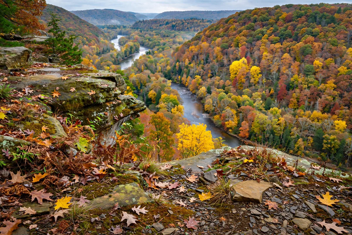 Scenic overlook of the forested Cuyahoga Valley near Broadview Heights, Ohio, with the river winding below in autumn colors